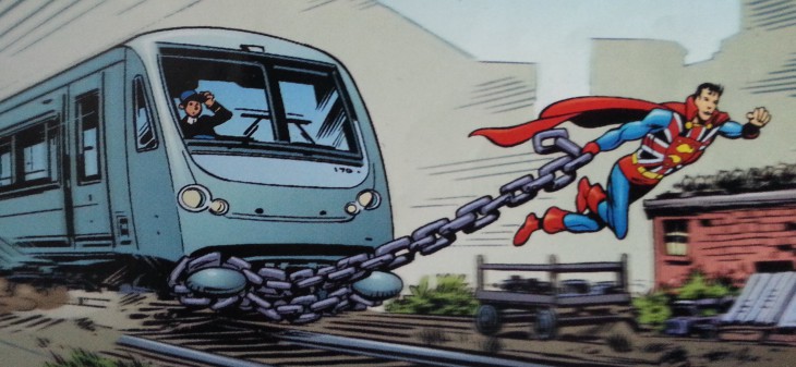 Disegno di Superman accanto a un treno da colorare